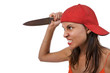 Profile of angry woman, holding a large knife as if to attack.