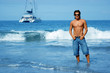 Young man standing on the beach