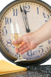 waiters hand places champagne glass on napkin