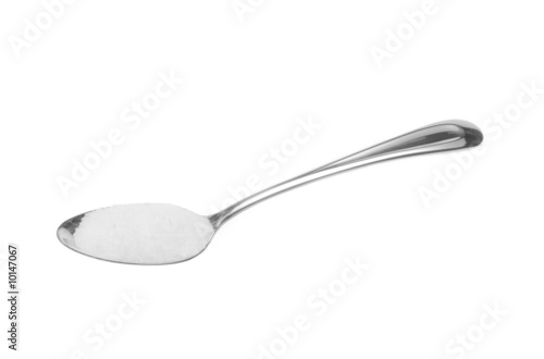 Photo: Spoonfull of white sugar isolated on white Spoonfull of white sugar isolated on white