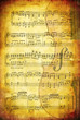 Grunge background with sheet music and a cello. Grunge background with sheet music and a cello.