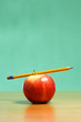 An apple on a desk in the classroom