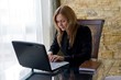 Girl working on laptop.