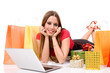 Beautiful young woman shopping over internet Beautiful young woman shopping over internet