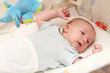 Sweet newborn lying in the cradle