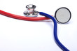 red and blue stethoscopes isolated in white background