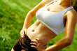 Close up view of beautiful womans abdomial muscles.