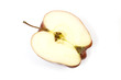 Red apple halved isolated on a white studio background.