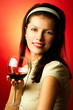 young pretty caucasian woman with wine over red