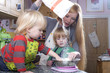 young family cooking in the kitchin