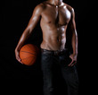 a hunky asian basketball player with a ball in hand