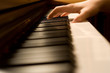 The hand on piano keyboard