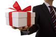 a businessman offering a gift to you (selective focus)