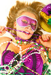 close up young beautiful caucasian in mardi gras dress
