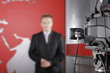 TV studio with video camera and unrecognizable presenter TV studio with video camera and unrecognizable presenter