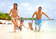 Photo: happy family having fun on holidays - togetherness concept happy family having fun on holidays - togetherness concept