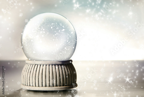 Snow globe against a silver background