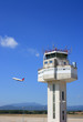 Photo: Airport control tower and airplane taking-off Airport control tower and airplane taking-off