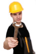 Construction worker in yellow hardhat giving the silver wrench