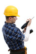 Construction worker fixing the electric hand drill