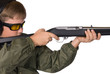 A boy aims his rifle.