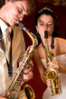 Just married. Happy couple playing music at club