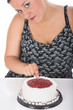 Chubby girl and cake, isolated on white