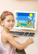 Foto: Little girl draws at the home computer Little girl draws at the home computer