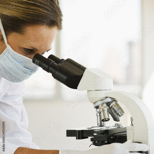 Photo: Female Doctor with Microscope. Female Doctor with Microscope.
