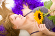 The dreaming beautiful girl with a sunflower The dreaming beautiful girl with a sunflower