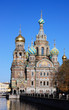 Spas-na-krovi cathedral reflecting on channel water.
