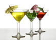 three cocktails with umbrella isolated on white