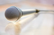 Silver steel microphone lying on the table