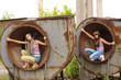 two beautiful girls sit in circles and listening music