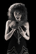 The beautiful singer on a black background