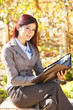 Business woman taking notes outside Business woman taking notes outside