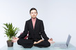 Foto: Young business woman doing yoga 2 Young business woman doing yoga 2