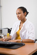 Doctor in uniform sitting in her office