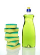 Bottle of green dishwashing liquid and sponges.