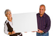 man & woman holding a blank over white background