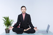 Young business woman doing yoga