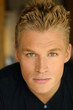 Close-up portrait of young male model in black shirt..