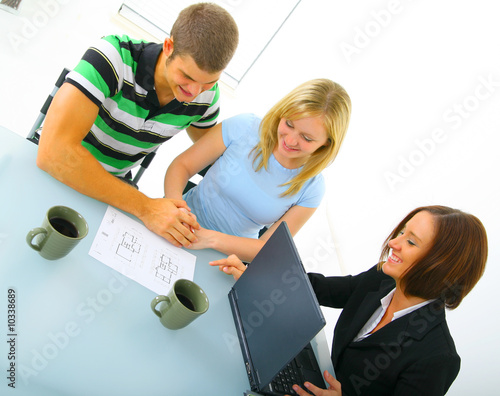young caucasian couple talking with real estate broker