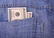 US dollars in blue jeans pocket closeup US dollars in blue jeans pocket closeup