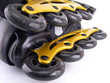 Two roller skate blades on white background closeup Two roller skate blades on white background closeup