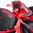 The top of black lingerie with red strings closeup The top of black lingerie with red strings closeup
