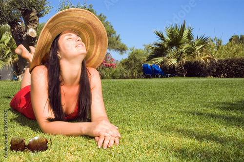 Photo: Young beautiful woman enjoying the sun Young beautiful woman enjoying the sun