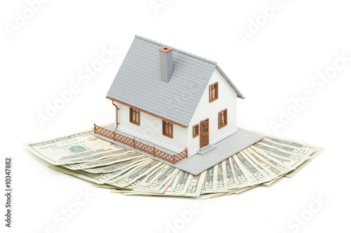 Foto: Home and Money Isolated on a White Background Home and Money Isolated on a White Background
