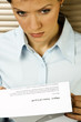 Young caucasian businesswoman received the notice of layoff