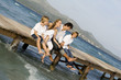 happy family relaxing on beach summer vacation